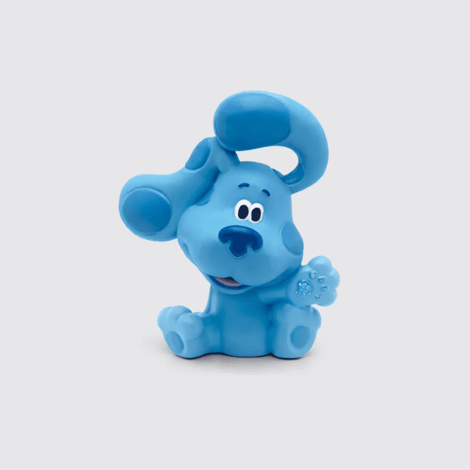 Figurine of a blue dog waving, with darker blue spots
